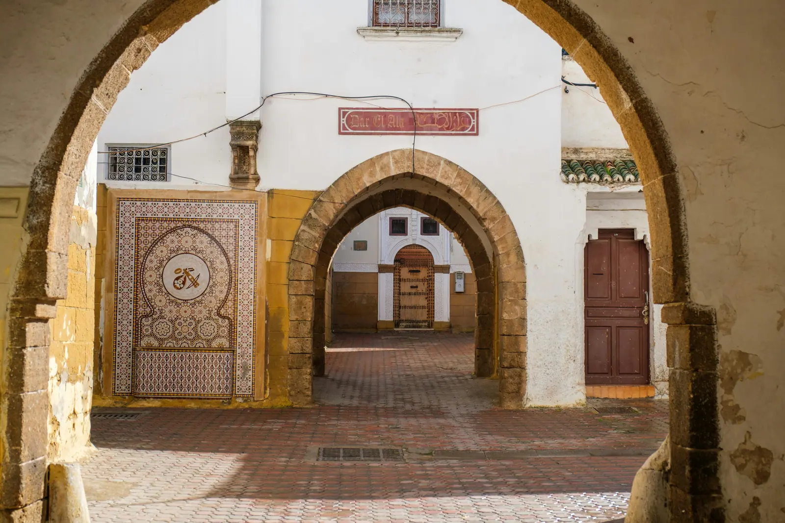 Vaulted passage with a zellige sign in Casablanca