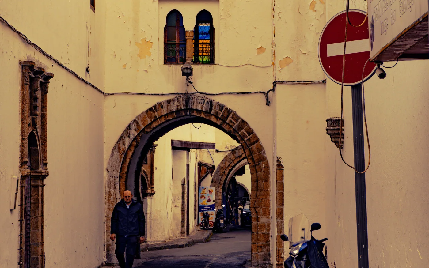Lane in an old district of Casablanca, with an arch