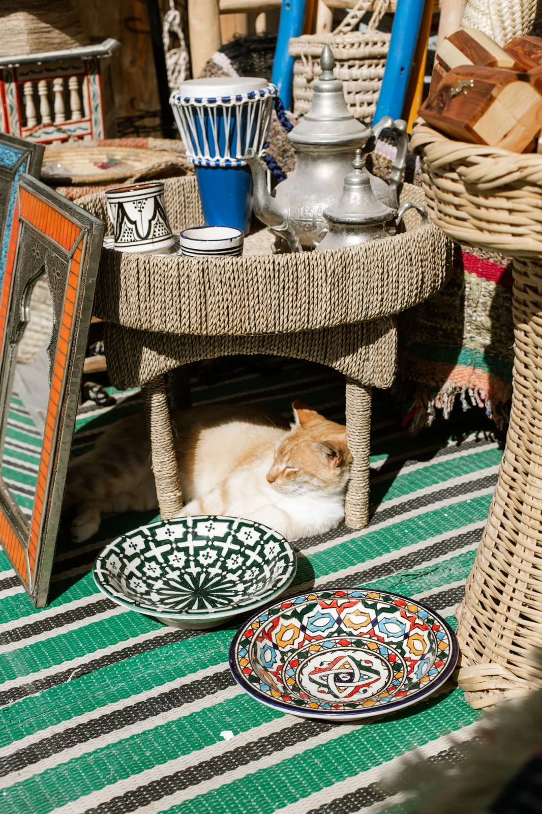 Teapot, glasses and painted ceramics in a Moroccan craft shop